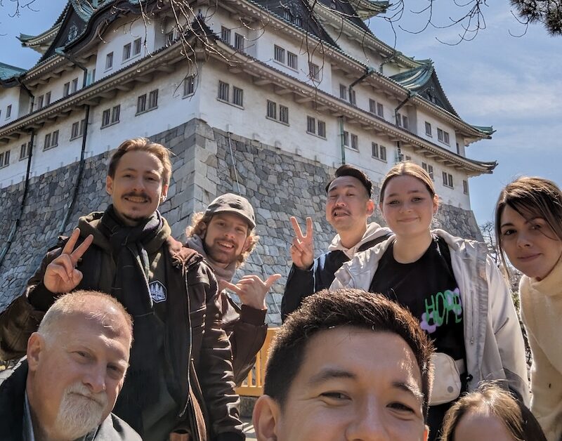 Posing for a picture in front of Nagoya Castle with visitors on the Recon Tour